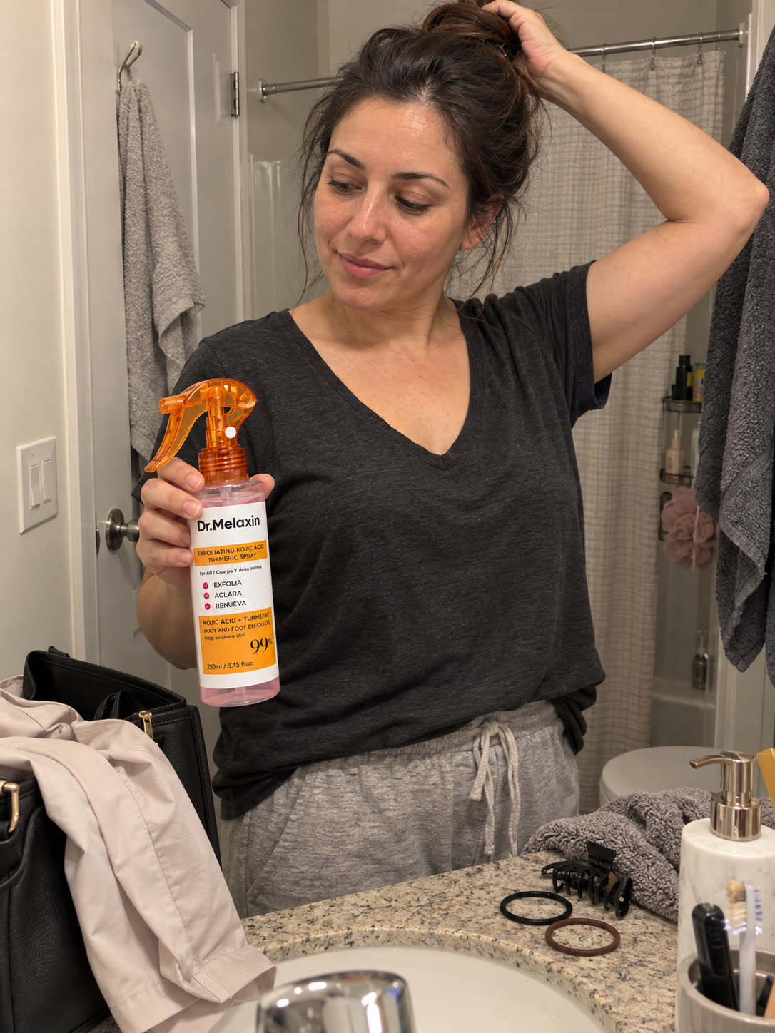 Customer using a quick spray exfoliation step in the shower