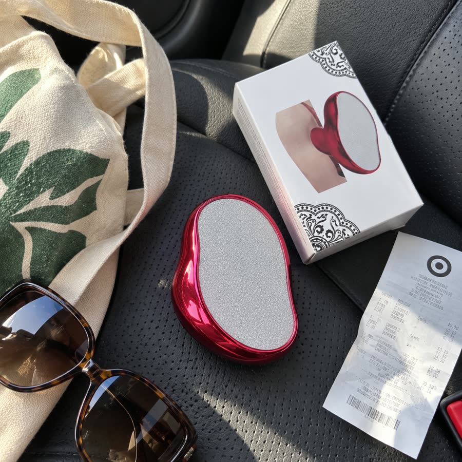 Red crystal hair eraser and product box on a car seat after shopping