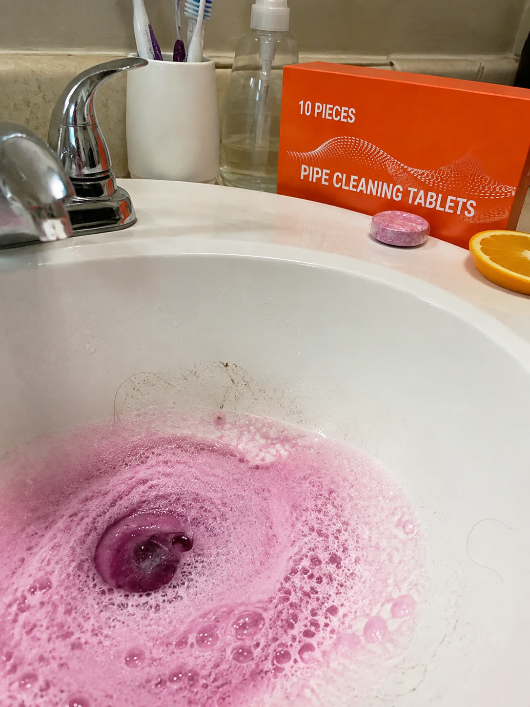 Customer photo showing orange fresh bathroom sink foam