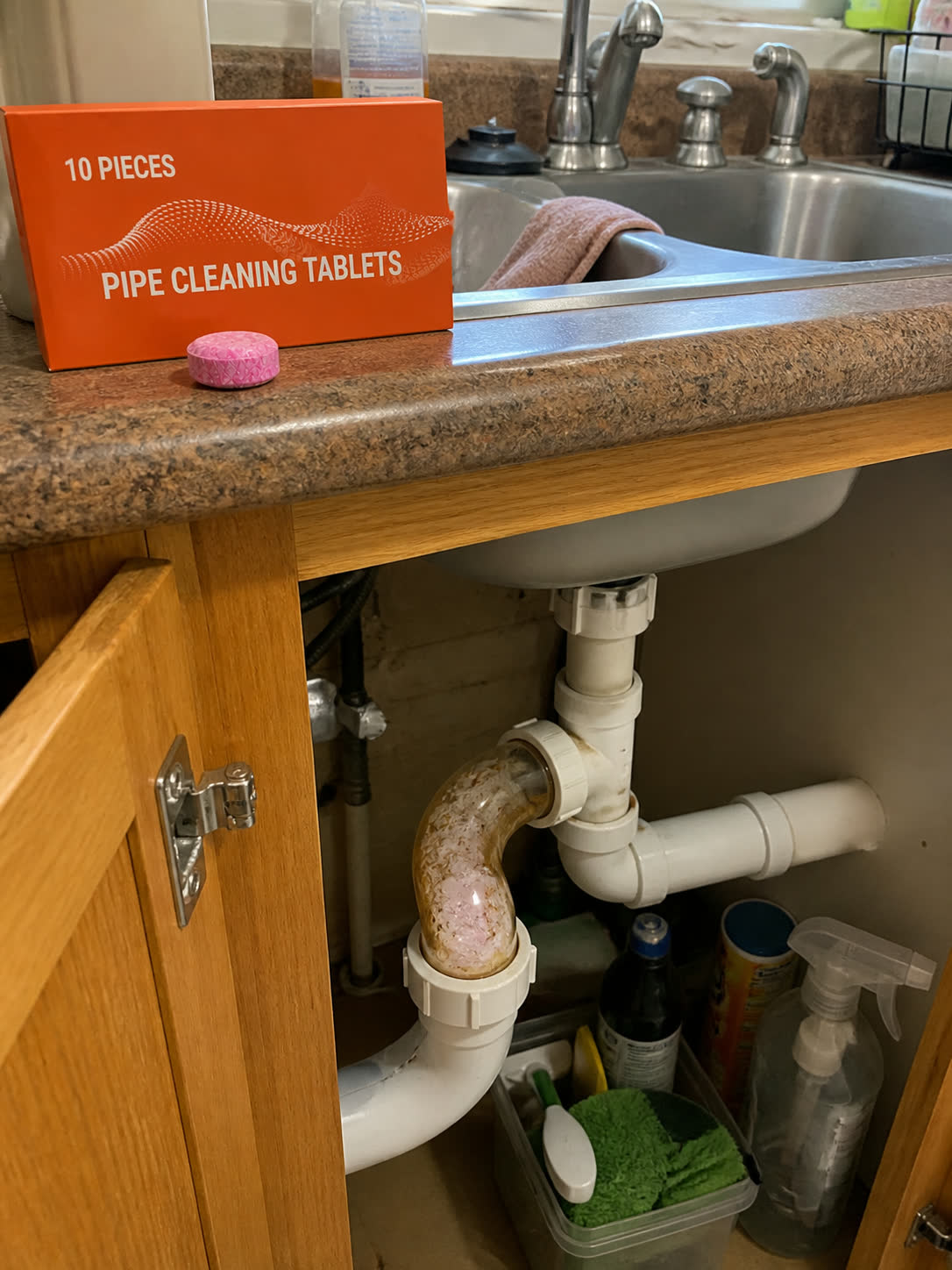Customer photo showing under sink pipe buildup