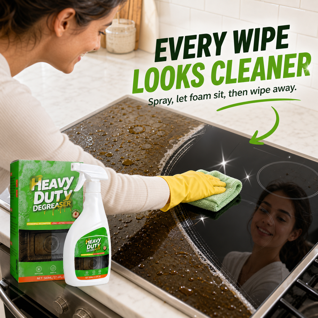 Wiping a greasy cooktop to reveal a cleaner-looking surface