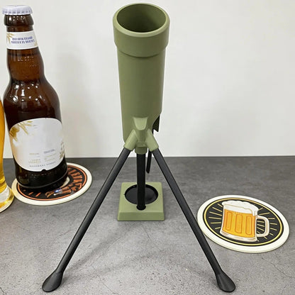Front view of the green tripod bottle opener beside a beer bottle