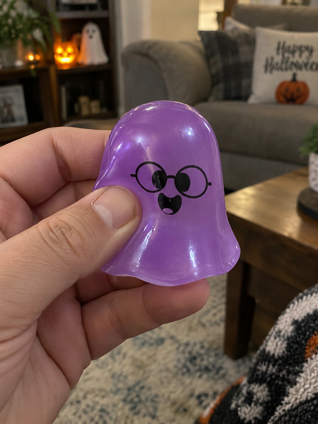 Customer review scene showing the ghost toy in a Halloween living room