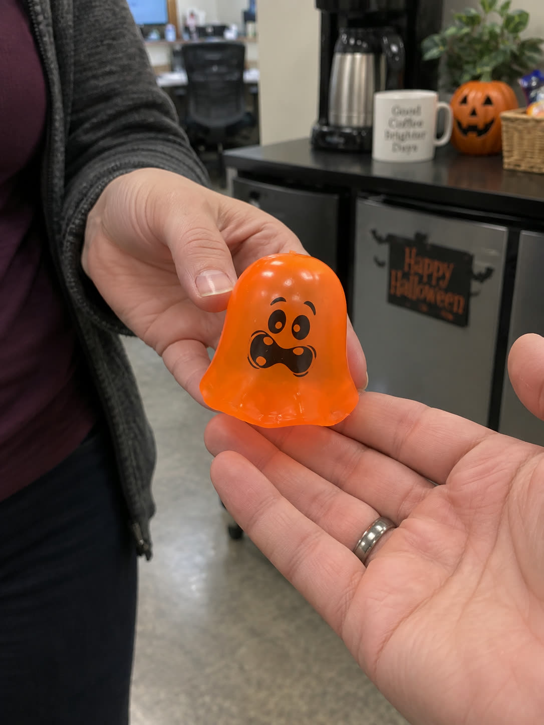 Customer review scene showing the ghost toy shared at work