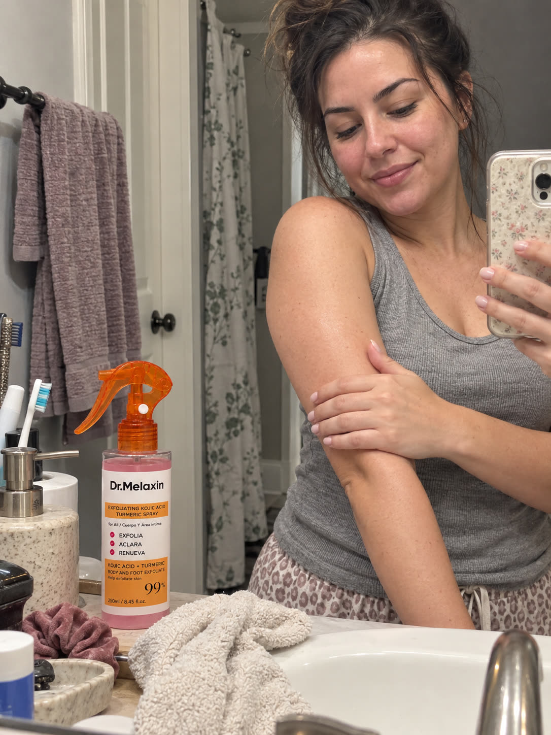 Customer showing smoother-feeling arms after body care