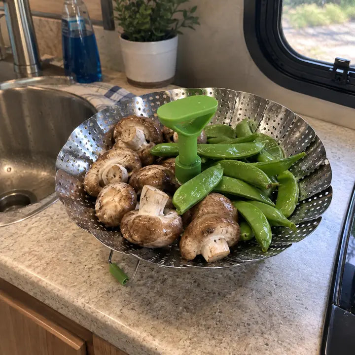 Customer using basket for mushrooms and snap peas