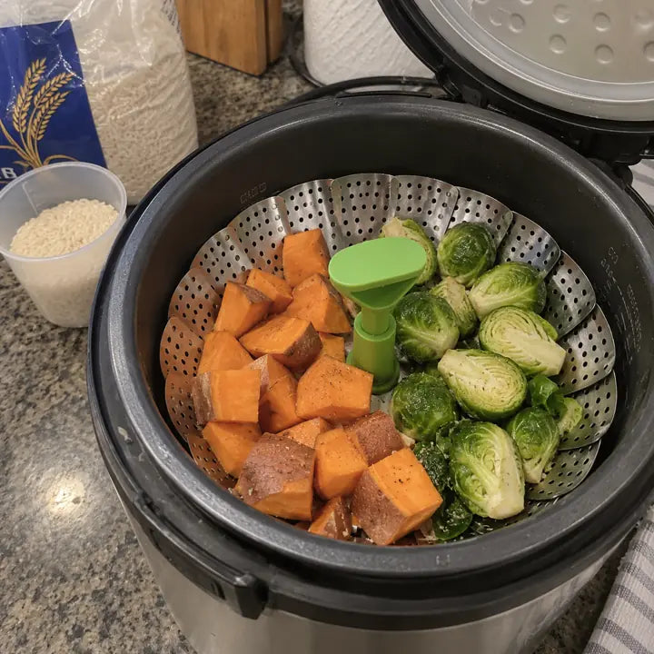 Customer using steamer basket inside electric pressure cooker