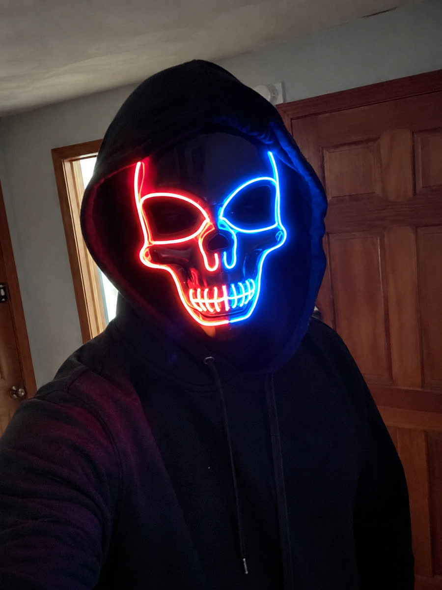 Customer wearing the LED glow skull mask with a black hoodie