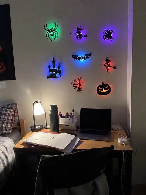 Customer desk wall display with glowing Halloween silhouette lights