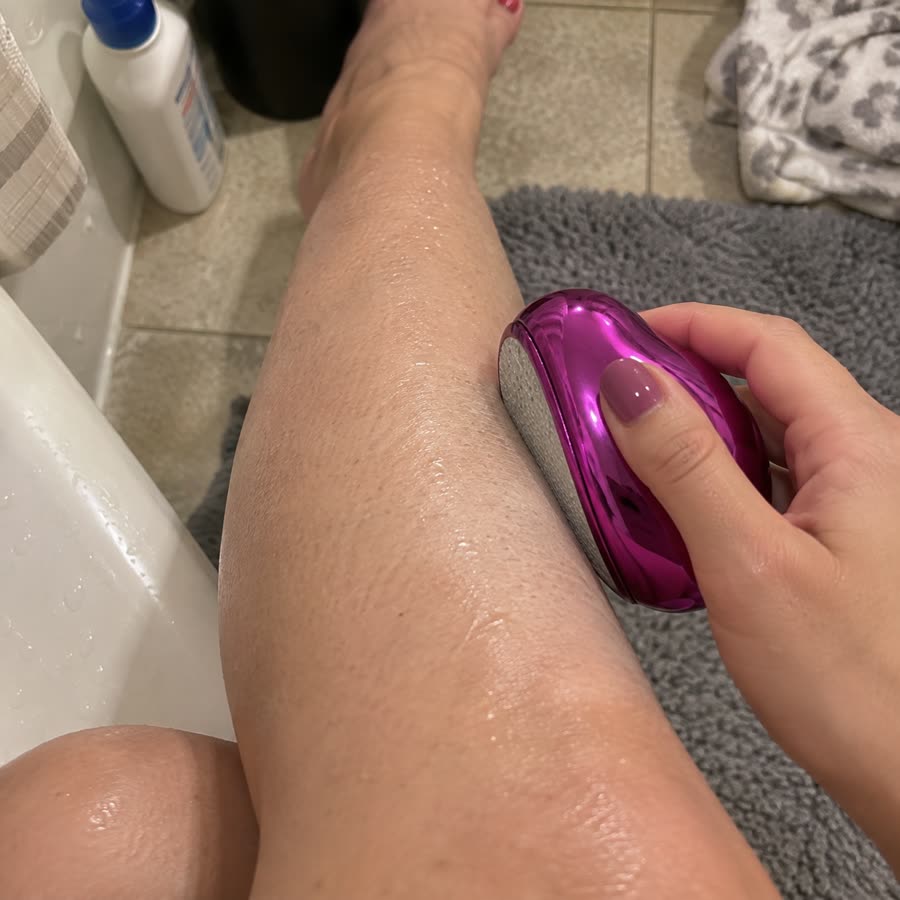 Pink crystal hair eraser used on a wet leg after shower