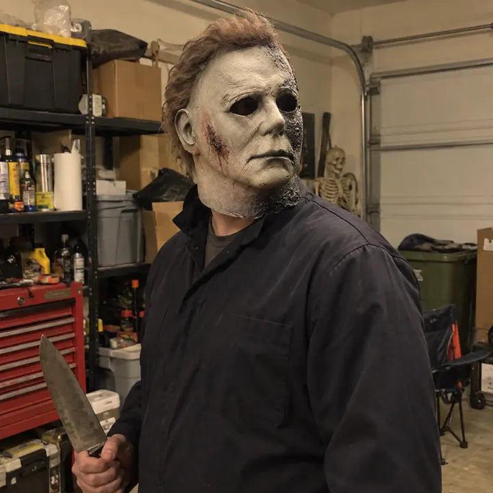 Halloween horror mask with costume prop in garage