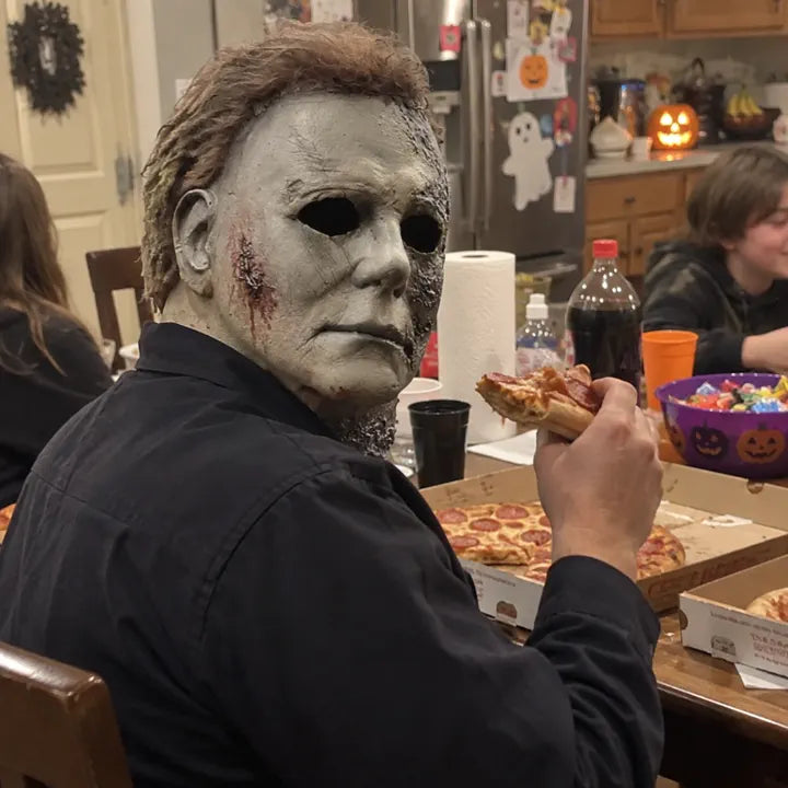 Halloween horror mask at indoor pizza party