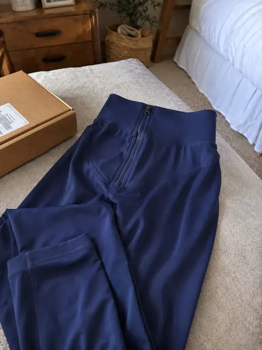 Blue leggings product close-up on a bed