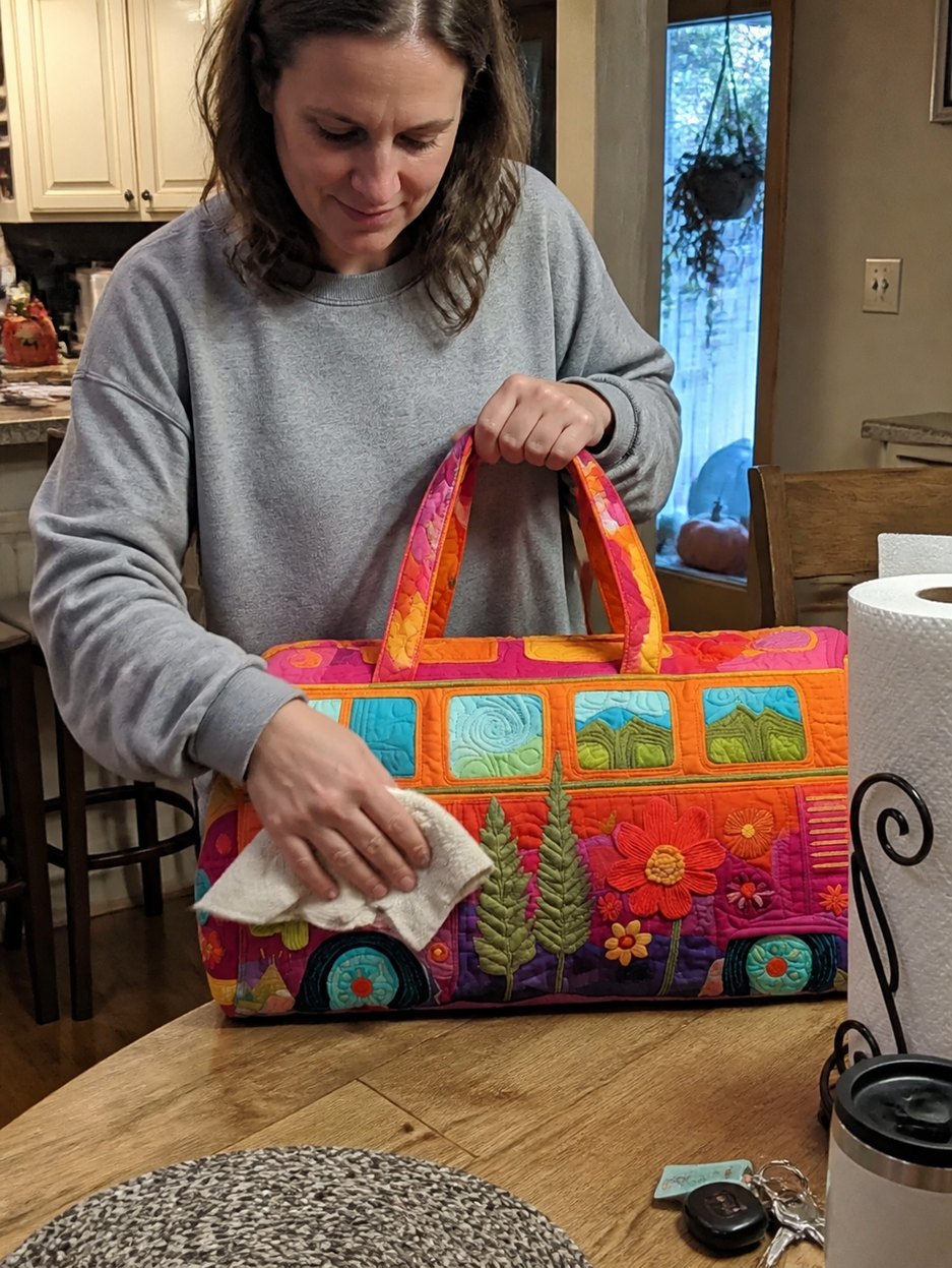 Rachel K. wiping the boho weekender clean after use