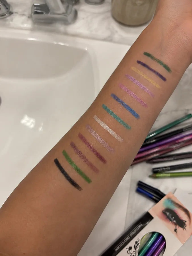 Customer arm swatches showing multiple colorful eyeliner pencil shades